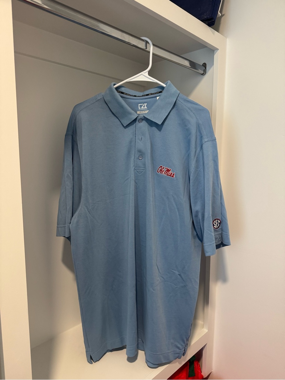 Light Blue Ole Miss Polo Shirt with SEC Logo on Sleeve